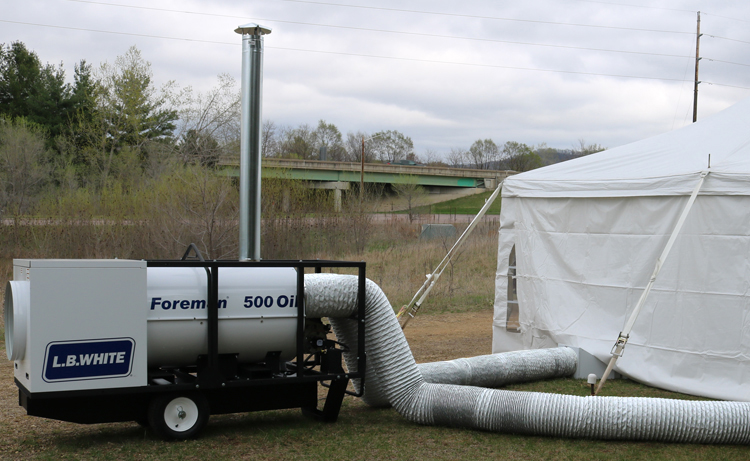 Foreman Oil heater heating an emergency tent.